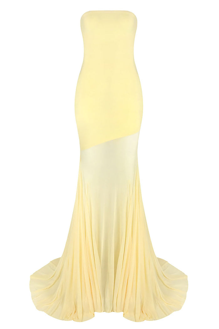 Yellow strapless gown with a gradient effect on a white background
