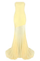 Yellow strapless gown with a gradient effect on a white background