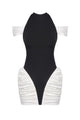 Black and white dress with ruched skirt on a white background