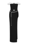 Conjunto de dos piezas con falda larga dividida y cintura alta con top corto con hombros descubiertos y vendaje negro