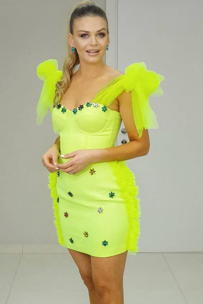 Minivestido Bandage con lazo de cristal verde fluorescente