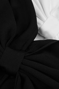 Vestido sem alças com gravata borboleta e mini bandagem em preto e branco